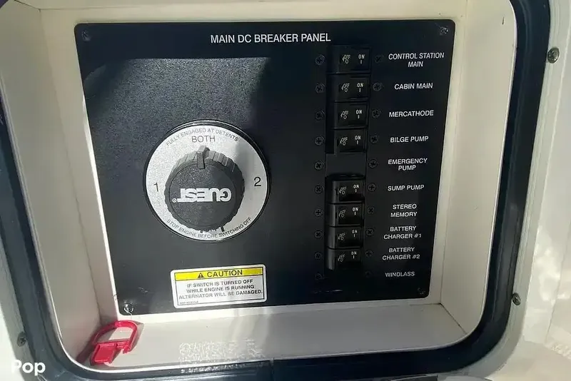 Slide: The Image of Main DC breaker panel on 2011 Sea Ray 240 Sundancer boat, featuring various switches and controls. - 25