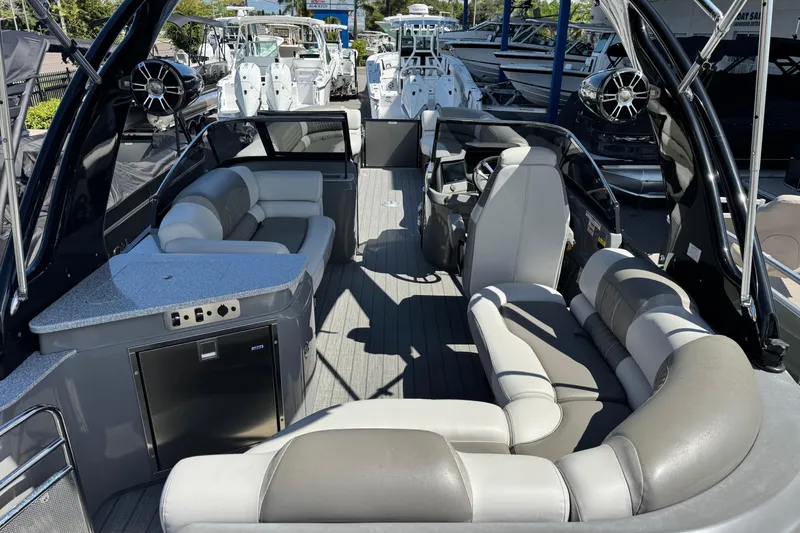 Slide: The Image of Luxurious 2023 Avalon Excalibur 27' boat interior with plush seating and modern amenities. - 11