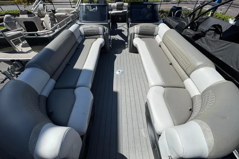 Slide: The Image of 2023 Avalon Excalibur 27' boat interior with spacious seating and modern design. - 24