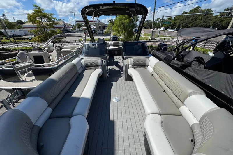 Slide: The Image of 2023 Avalon Excalibur 27' pontoon boat with spacious seating and modern design. - 25
