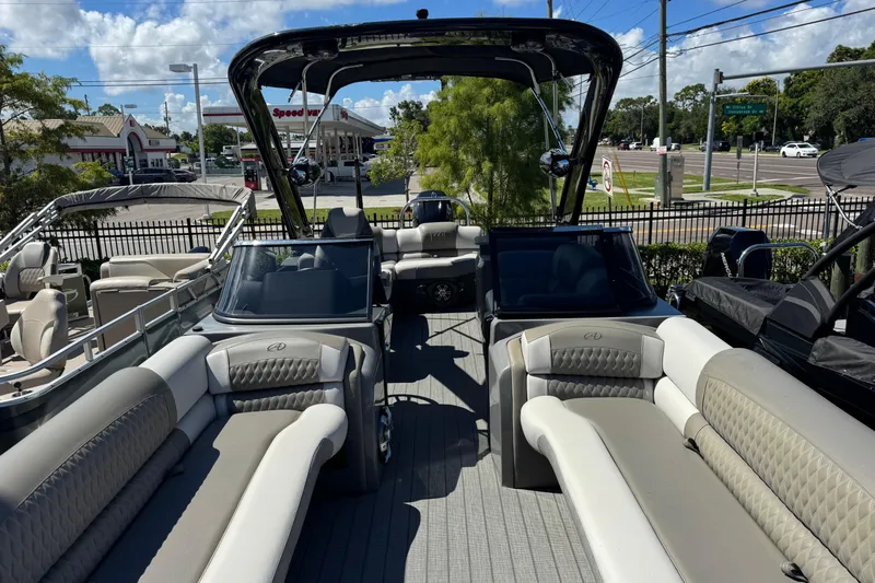 Slide: The Image of 2023 Avalon Excalibur 27' pontoon boat with luxurious seating and sleek design. - 26