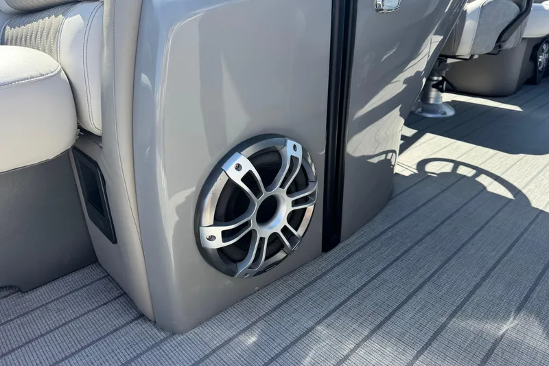 Slide: The Image of 2023 Avalon Excalibur boat interior with sleek speaker and luxurious seating. - 29