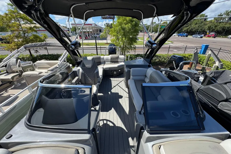 Slide: The Image of 2023 Avalon Excalibur 27' boat interior with luxurious seating and modern design. - 31
