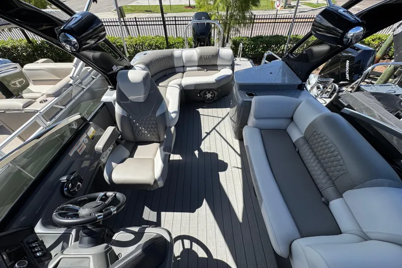 Slide: The Image of Luxurious interior of 2023 Avalon Excalibur 27' boat with plush seating and modern design. - 32