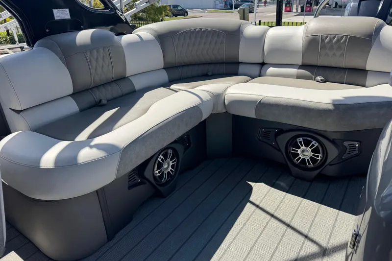 Slide: The Image of Luxurious seating on 2023 Avalon Excalibur 27' boat with integrated speakers. - 36