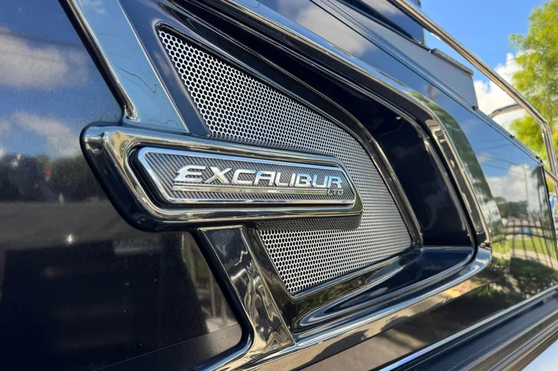 Slide: The Image of Close-up of 2023 Avalon Excalibur 27' logo on sleek black surface. - 4