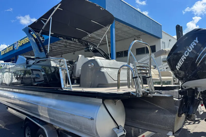 Slide: The Image of 2023 Avalon Excalibur 27' pontoon boat with Mercury engine at dealership. - 5