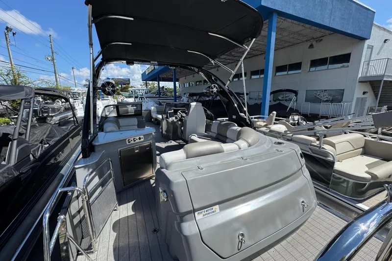 Slide: The Image of 2023 Avalon Excalibur 27' pontoon boat with sleek interior and modern design. - 8