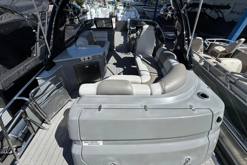 Slide: The Image of Luxurious 2023 Avalon Excalibur 27' boat interior with plush seating and modern amenities. - 9