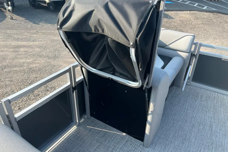 Slide: The Image of 2026 Tahoe Pontoon 2180 REAR FISH boat interior with seating and storage area. - 10