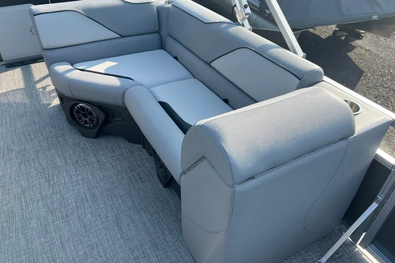 Slide: The Image of 2026 Tahoe Pontoon 2180 REAR FISH boat seating with gray upholstery and integrated speakers. - 20