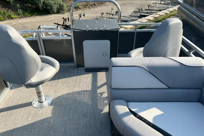 Slide: The Image of 2026 Tahoe Pontoon 2180 REAR FISH interior with seating and control panel. - 22