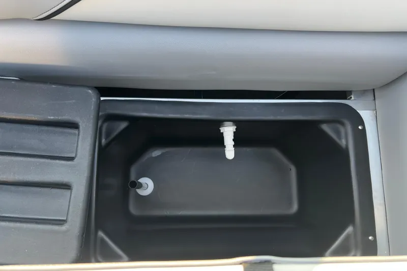 Slide: The Image of 2026 Tahoe Pontoon 2180 REAR FISH livewell interior with drain plug. - 5