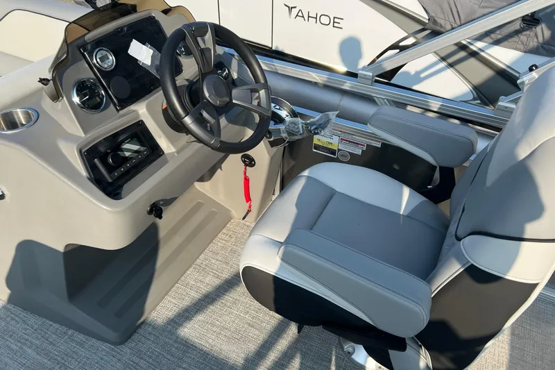 Slide: The Image of 2026 Tahoe Pontoon 2180 REAR FISH boat interior with steering wheel and captain's chair. - 6