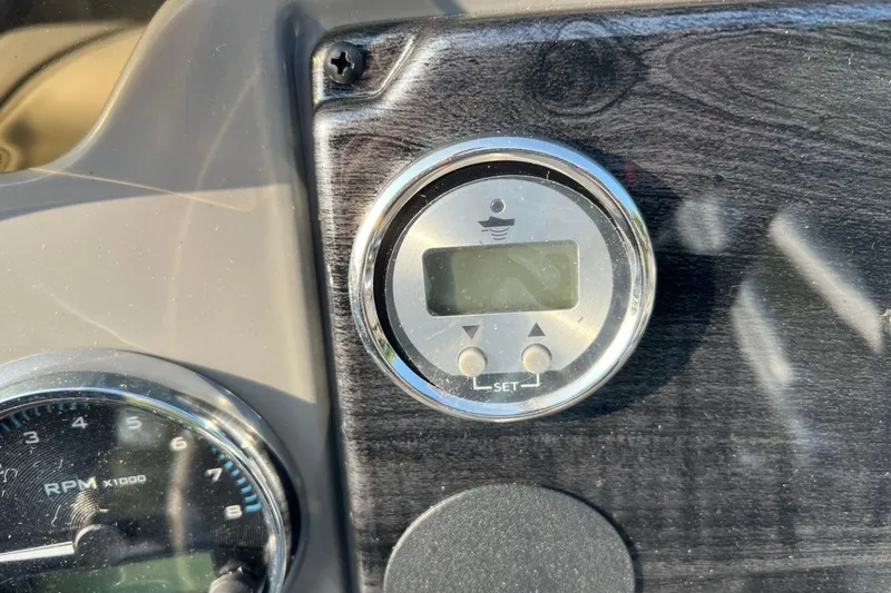 Slide: The Image of Dashboard of 2026 Tahoe Pontoon 2180 REAR FISH with digital display and RPM gauge. - 8