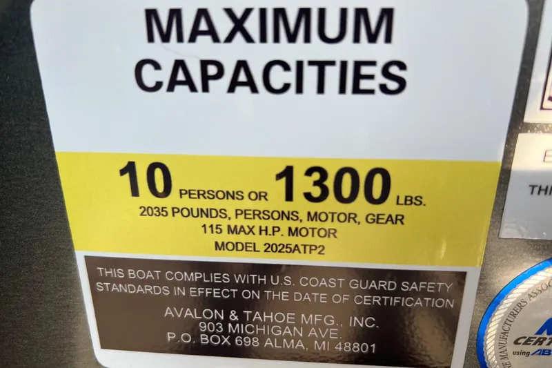 Slide: The Image of 2026 Tahoe Pontoon 2180 REAR FISH capacity label, 10 persons or 1300 lbs, 115 HP motor. - 9