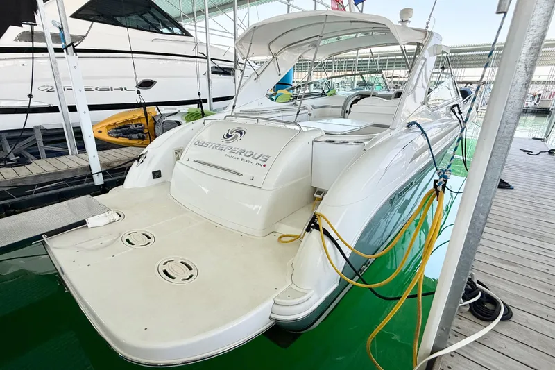 The Image of 2004 Formula 400 Super Sport yacht docked, featuring sleek design and spacious deck. - 1