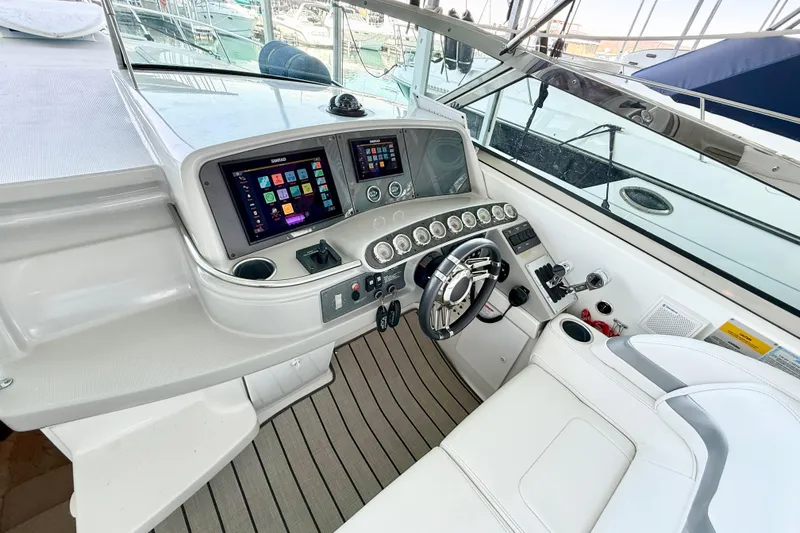 Slide: The Image of 2004 Formula 400 Super Sport yacht cockpit with modern navigation displays and controls. - 10