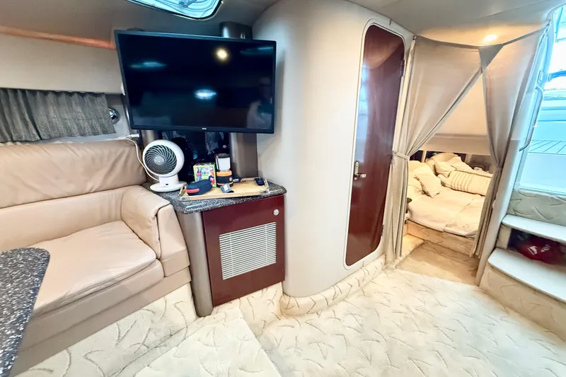 Slide: The Image of Interior of 2004 Formula 400 Super Sport yacht with cozy seating and modern amenities. - 19