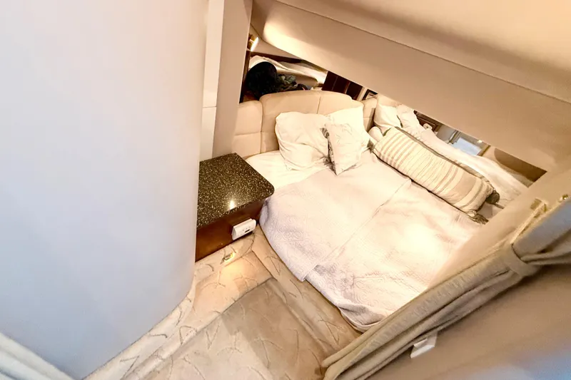 Slide: The Image of Luxurious cabin interior of 2004 Formula 400 Super Sport yacht with cozy bedding. - 21