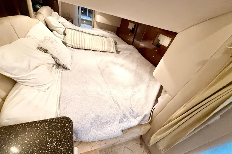 Slide: The Image of Cozy cabin interior of 2004 Formula 400 Super Sport with comfortable bedding. - 22