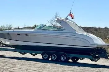 Slide: The Image of 2004 Formula 400 Super Sport boat on trailer, side view, outdoors. - 31