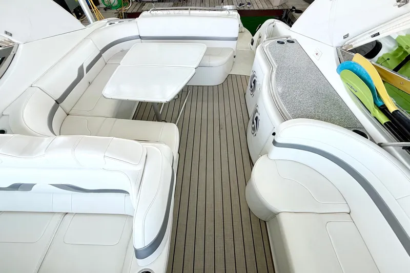 Slide: The Image of Luxurious interior of a 2004 Formula 400 Super Sport boat with white seating and table. - 9