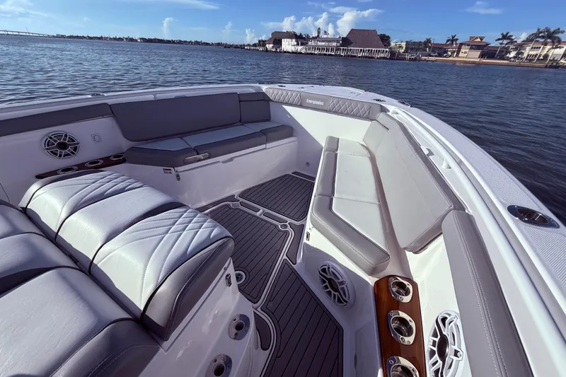 Slide: The Image of 2023 Everglades 395 Center Console boat interior with luxurious seating and ocean view. - 35