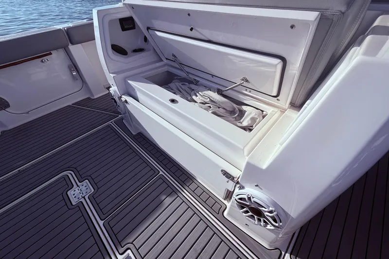 Slide: The Image of 2023 Everglades 395 Center Console boat interior with open storage compartment. - 40