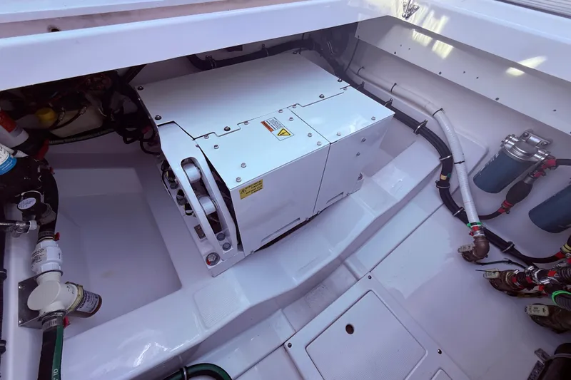 Slide: The Image of Engine compartment of 2023 Everglades 395 Center Console boat, showcasing mechanical components. - 42