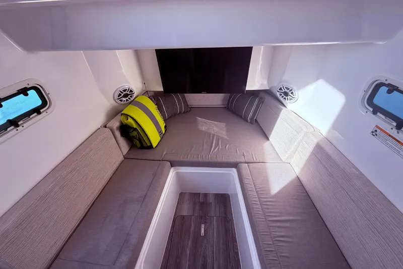 Slide: The Image of Interior cabin of 2023 Everglades 395 Center Console with seating and life jacket. - 54