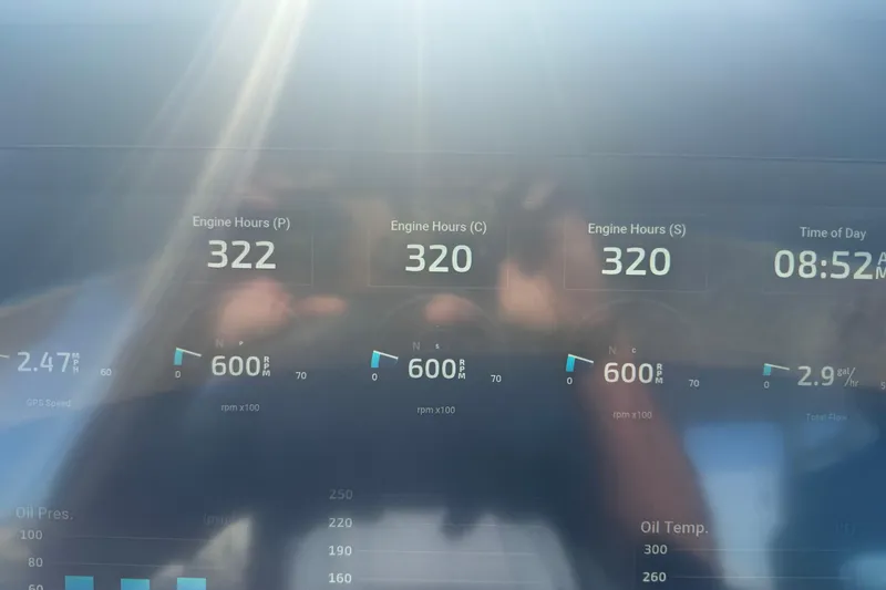Slide: The Image of Dashboard of 2023 Everglades 395 Center Console showing engine hours and RPM. - 66