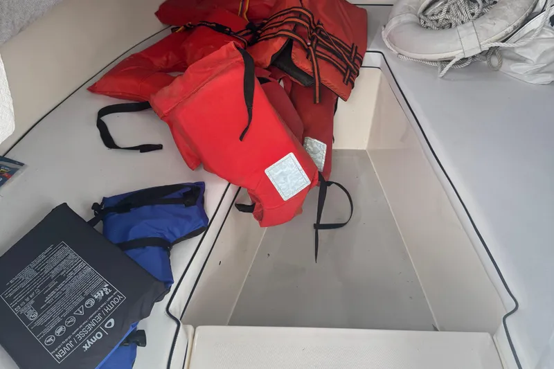 Slide: The Image of Life jackets and safety gear on a 1993 Angler 22 Walk Around boat. - 8