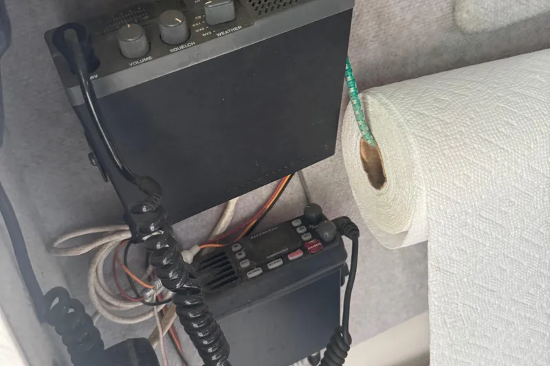 Slide: The Image of VHF radio equipment and paper towel roll on 1993 Angler 22 Walk Around boat. - 9