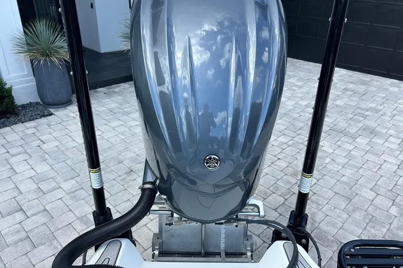 Slide: The Image of 2016 Yellowfin 24 Bay boat with Yamaha outboard motor on paved driveway. - 20