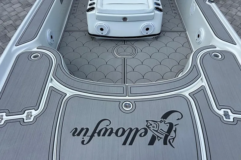 Slide: The Image of 2016 Yellowfin 24 Bay boat deck with custom non-slip flooring and logo design. - 22