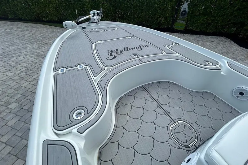 Slide: The Image of 2016 Yellowfin 24 Bay boat with custom deck design and logo. - 27
