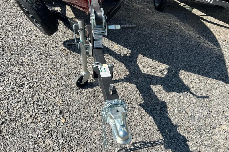 Slide: The Image of Trailer hitch of 2026 Lund 1650 Rebel XL Sport on gravel surface. - 18