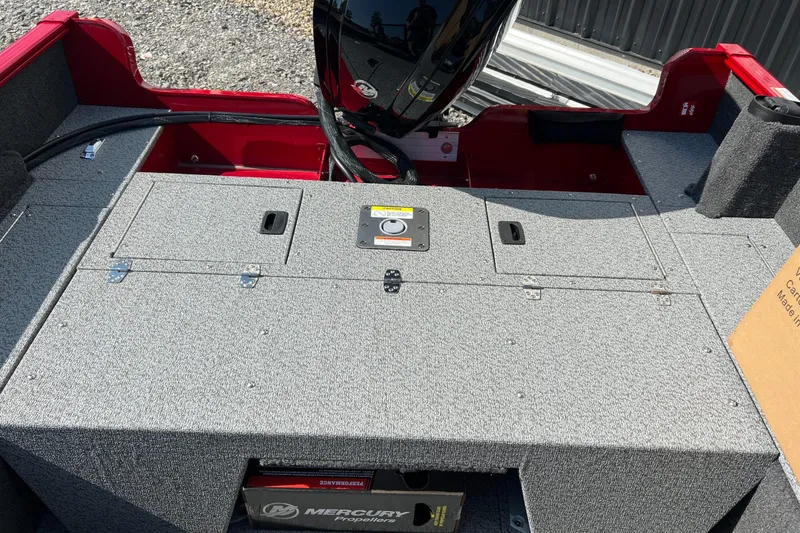 Slide: The Image of 2026 Lund 1650 Rebel XL Sport boat interior with Mercury propeller box. - 6