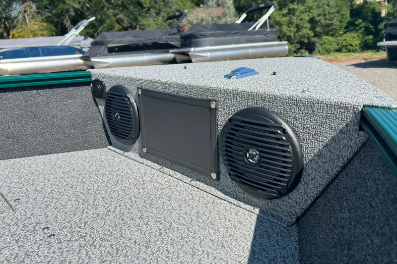 Slide: The Image of 2026 Lund 1650 Angler SS boat interior with speakers and textured finish. - 11