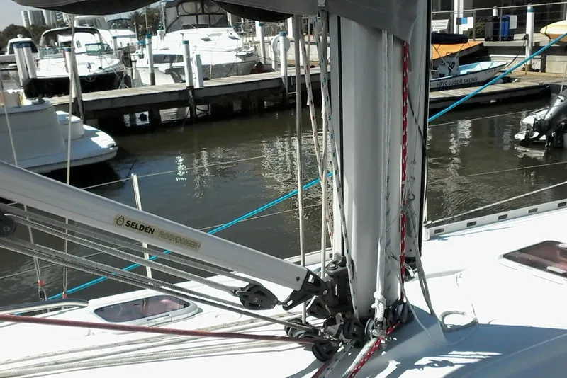 Slide: The Image of Delphia 33 sailboat from 2007 docked, featuring Selden mast and rigging. - 16