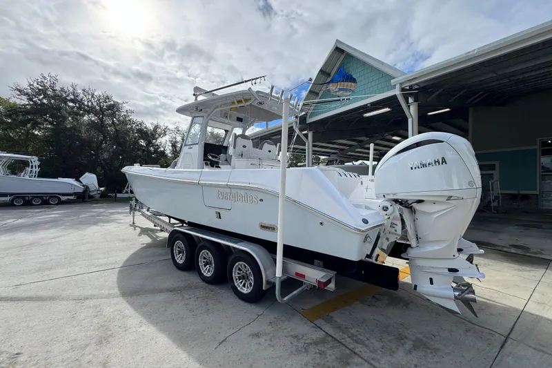 Slide: The Image of 2022 Everglades 295 Center Console boat with Yamaha engines on a trailer. - 16