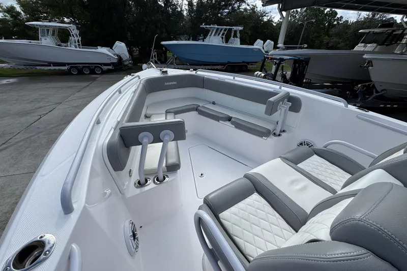 Slide: The Image of 2022 Everglades 295 Center Console boat interior with gray and white seating. - 20