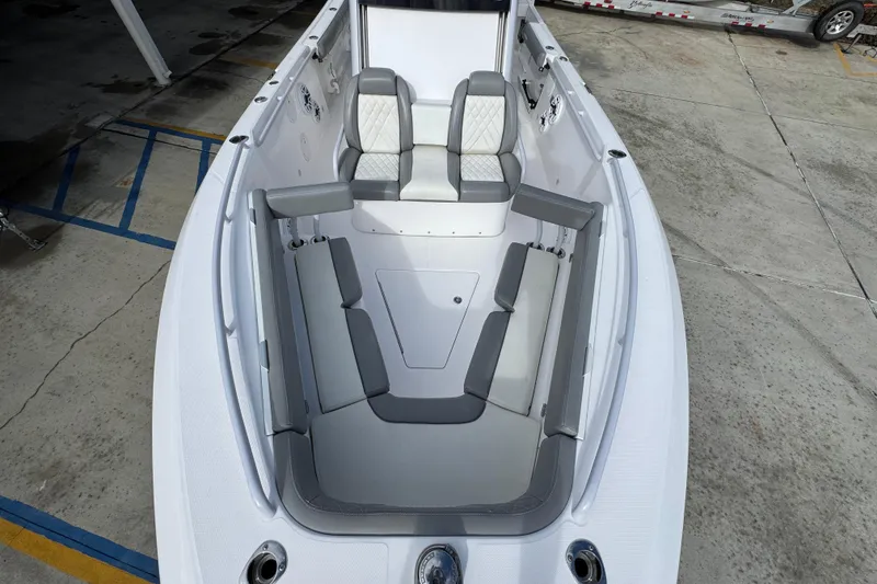 Slide: The Image of 2022 Everglades 295 Center Console boat interior with cushioned seating. - 22