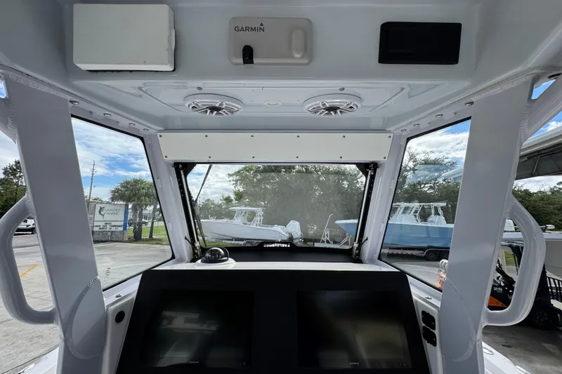 Slide: The Image of 2022 Everglades 295 Center Console boat interior with Garmin navigation system. - 34