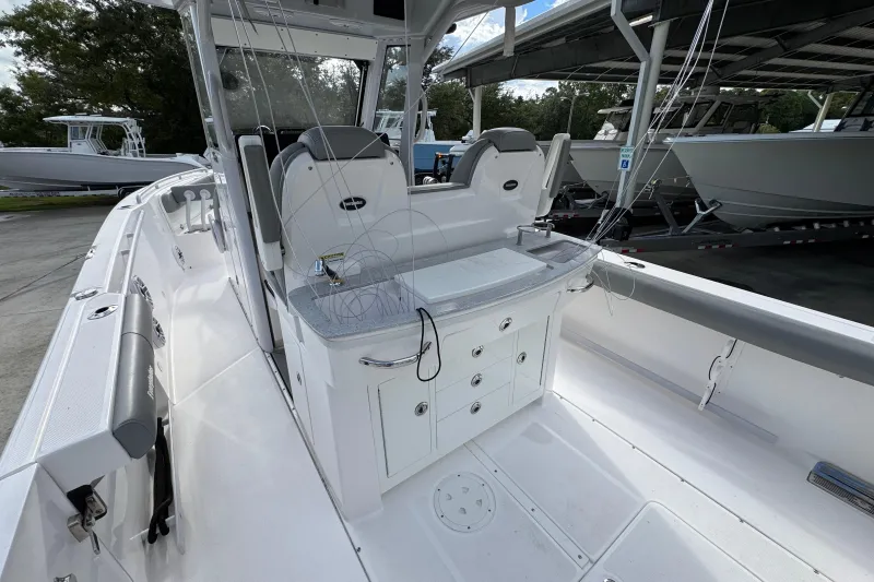 Slide: The Image of 2022 Everglades 295 Center Console boat interior with seating and storage compartments. - 35