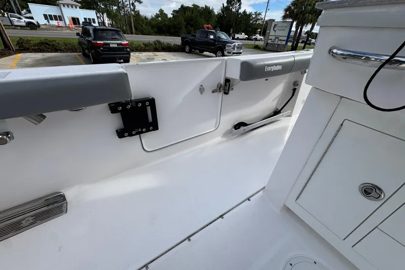 Slide: The Image of 2022 Everglades 295 Center Console boat interior with storage compartments and seating. - 37