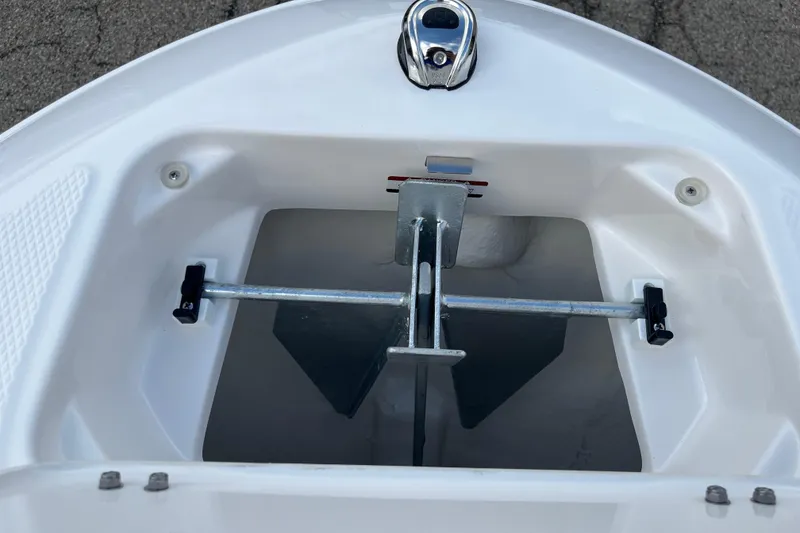 Slide: The Image of Anchor compartment of 2026 Chaparral 21 SSi boat, featuring secure storage. - 11