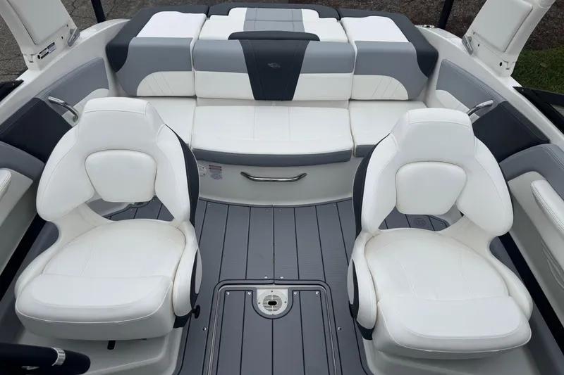 Slide: The Image of 2026 Chaparral 21 SSi boat interior with white and gray seating. - 13
