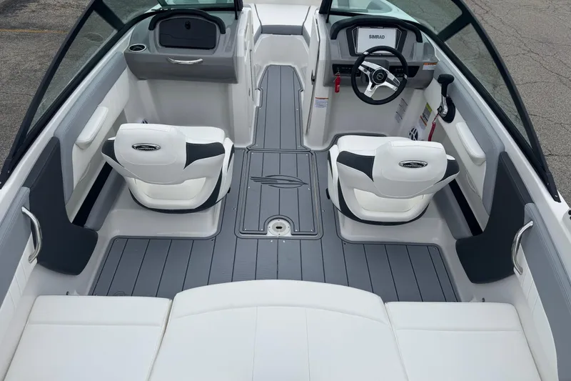 Slide: The Image of 2026 Chaparral 21 SSi boat interior with white seating and gray flooring. - 19